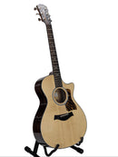 A cutaway acoustic-electric guitar with a natural wood top and dark brown sides, displayed on a black stand against a light gray background.