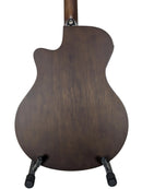 The back of a dark brown wooden acoustic-electric guitar, displayed on a black stand against a plain white background.