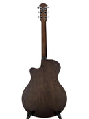 The back view of a dark brown acoustic-electric guitar on a black stand against a light gray background.